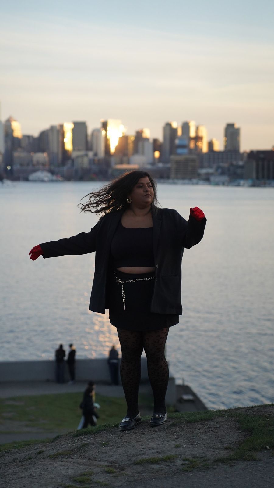 Lakshmi with the Seattle skyline at sunset