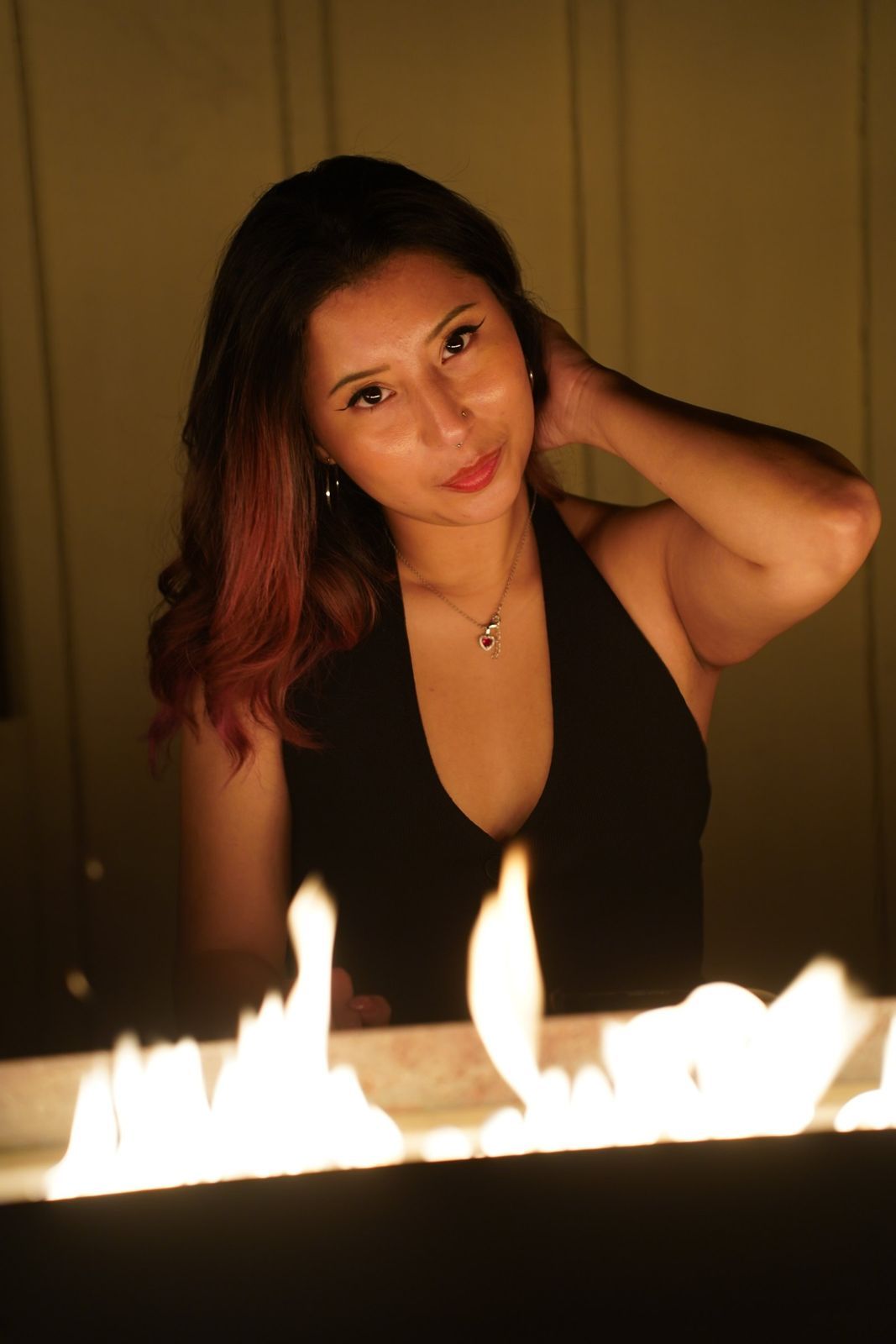 Portrait beside a fire pit at night