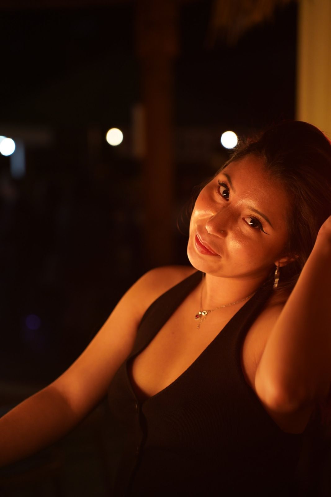 Night portrait with warm city lights